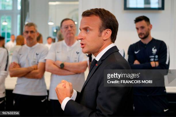 French President Emmanuel Macron speaks to the French national football team players during a meeting at France team's training camp in...