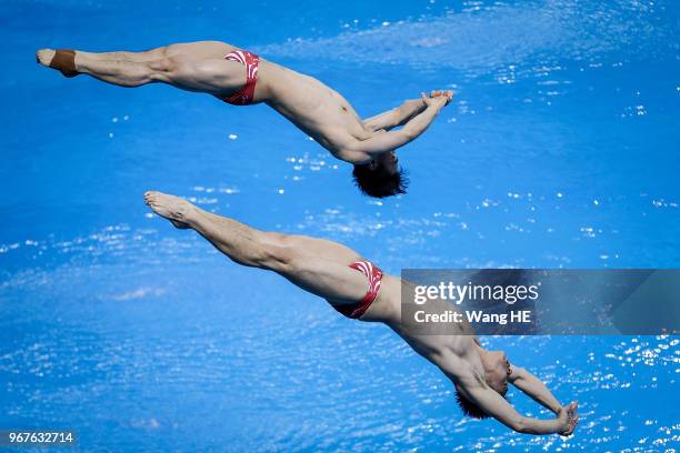 Cao yuan and Xie siyi of China compete in the man's 3m Synchro Springboard final on FINA Diving World Cup 2018 at the Wuhan Sports Center on June 5,...