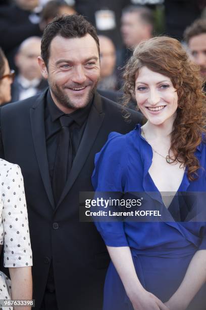 Actor Denis Menochet and guest attend the 'Blood Ties' Premiere during the 66th Annual Cannes Film Festival at the Palais des Festivals on May 20,...
