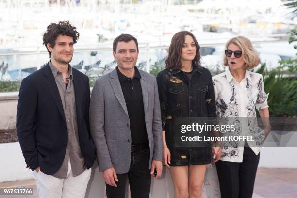 Louis Garrel, Marion Cotillard, director Nicole Garcia and Alex Brendemuehl attend the 'From The Land And The Moon ' Photocall during the 69th annual...