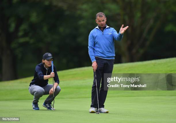 Sarah Walton and Robert Pask of Belton Park Golf Club line up a put on the 3rd green during The Lombard Trophy Midland Qualifier at Little Aston Golf...