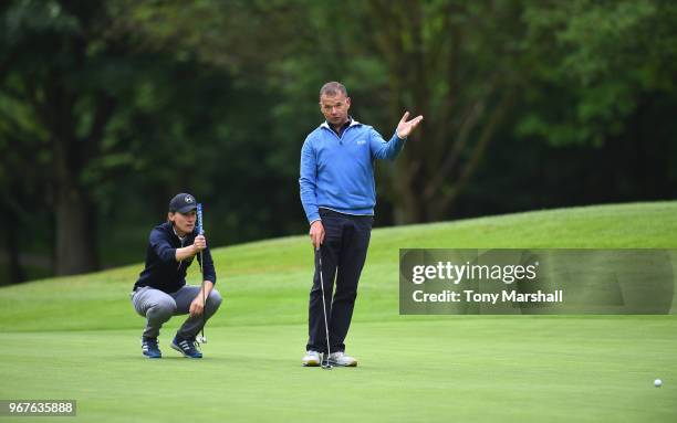 Sarah Walton and Robert Pask of Belton Park Golf Club line up a put on the 3rd green during The Lombard Trophy Midland Qualifier at Little Aston Golf...