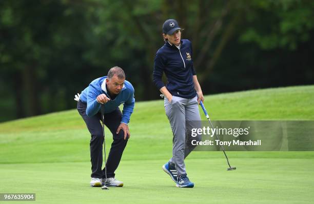 Robert Pask and Sarah Walton of Belton Park Golf Club line up a put on the 3rd green during The Lombard Trophy Midland Qualifier at Little Aston Golf...