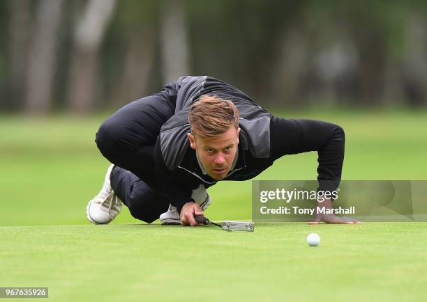 Luke Towler of Telford Golf and Country Club lines up a putt on the 15th green during The Lombard Trophy Midland Qualifier at Little Aston Golf Club...