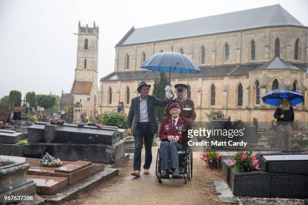 Ray Shuck who was a paratrooper on D-Day and was later shot in the head by a German sniper sits visits the church in Ranville where he was given the...