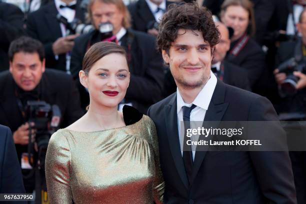 Marion Cotillard and Louis Garrel attend the 'From The Land Of The Moon ' premiere during the 69th annual Cannes Film Festival at the Palais des...