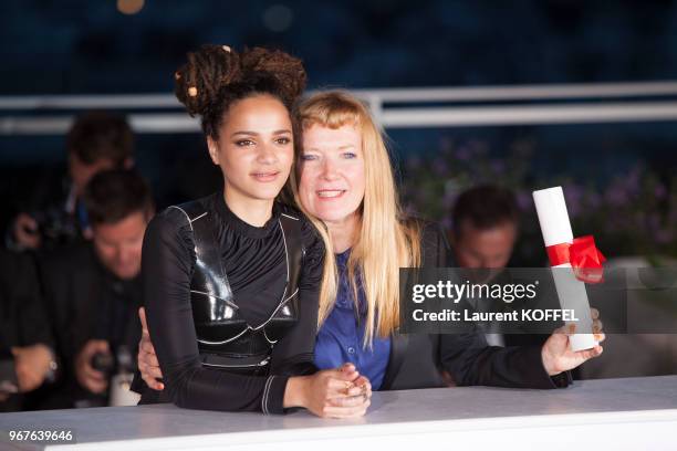 Director Andrea Arnold celebrates with Sasha Lane after being awarded the Jury Prize for the film 'American Honey' during the Palme D'Or Winner...