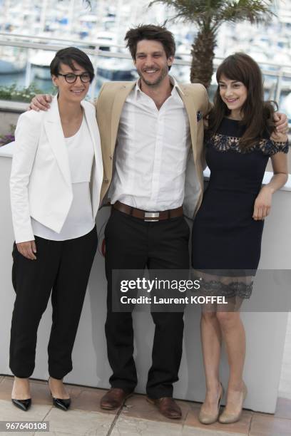 Director Chloe Robichaud, actor Jean-Sebastien Courchesne and actress Sophie Desmarais attend the photocall for 'Sarah Prefere La Course' during The...