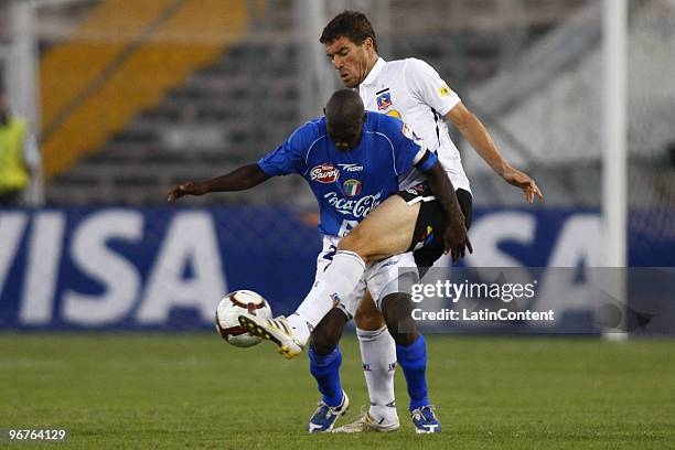 Player Andres Scotti of Colo Colo vies for the ball with Cristian Casseres of Deportivo Italia during their soccer match as part of 2010 Libertadores...