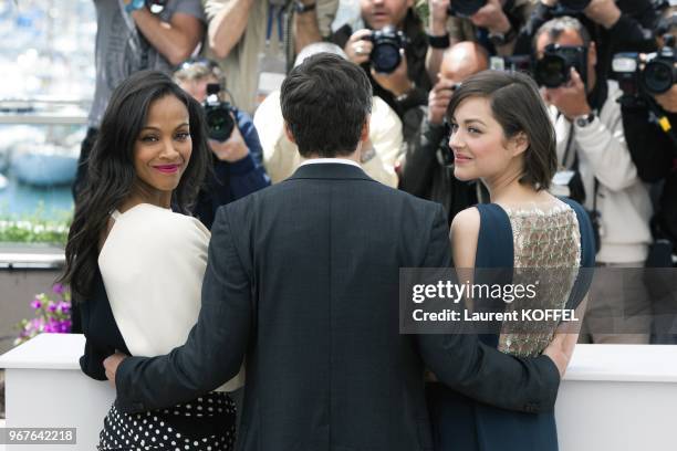 Zoe Saldana, Director Guillaume Canet and Marion Cotillard attend the photocall for 'Blood Ties' during the 66th Annual Cannes Film Festival at the...