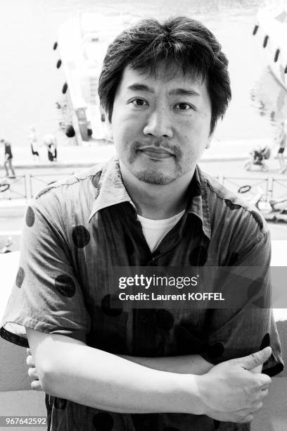 Japanese director Hirokazu Kore-Eda portrait session on May 14, 2013 while posing during a photocall for his film 'Like Father, Like Son' presented...