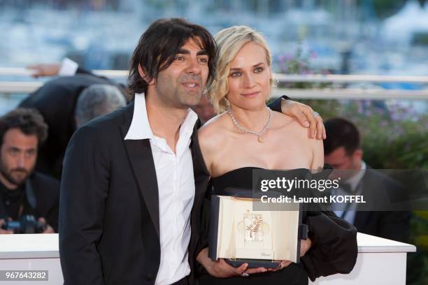 Actress Diane Kruger, who won the award for best actress for her part in the movie 'In The Fade' , and director Fatih Akin attend the Palme D'Or...