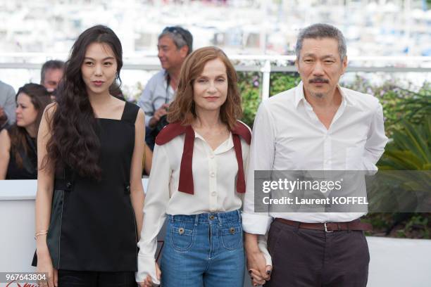 Actresses Kim Minhee, Isabelle Huppert, Director Hong SangSoo attend the 'Claire's Camera ' photocall during the 70th annual Cannes Film Festival at...