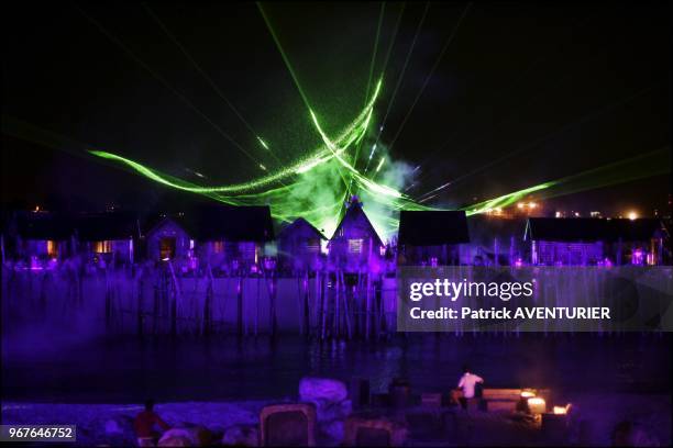 Santosa's Siloso Beach exploded in a dazzling display of pyrotechnics and laser lights in the night as Song of the sea-the island's latest...