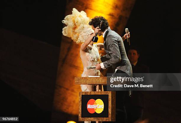 Lady Gaga receives the International Album Award for The Fame presented by Mika on stage during The Brit Awards 2010 at Earls Court One on February...