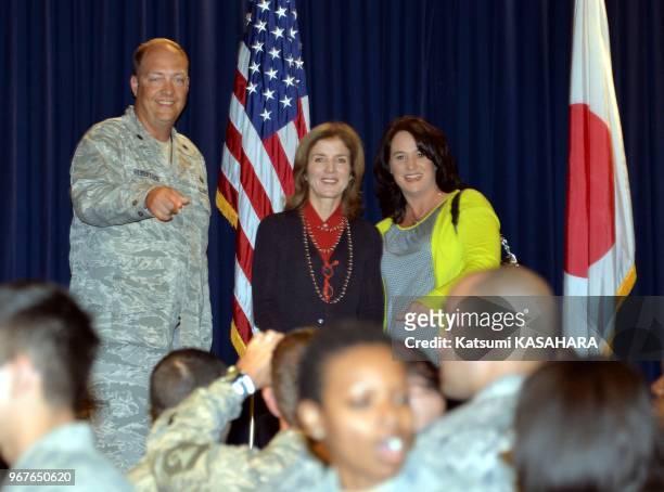 Newly appointed US Ambassador to Japan Caroline Kennedy, daughter of slain US President John F. Kennedy, left, chats with US soldier family during...