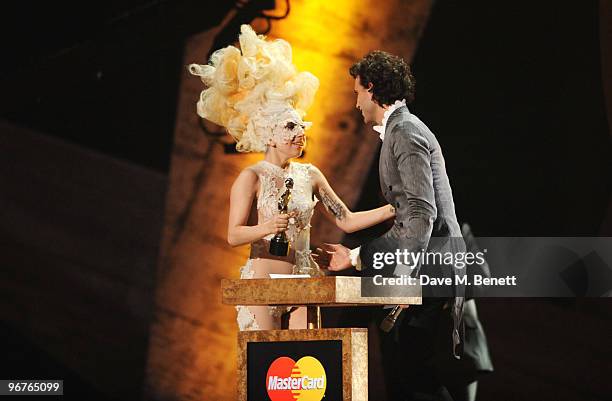 Lady Gaga receives the International Album Award for The Fame presented by Mika on stage during The Brit Awards 2010 at Earls Court One on February...