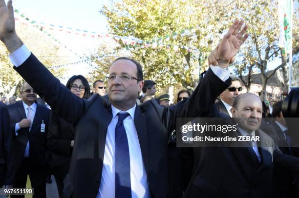 French President Francois Hollande and algerian president Abdelaziz Bouteflika greeting the crowd during a two-day state visit on December 20, 2012...