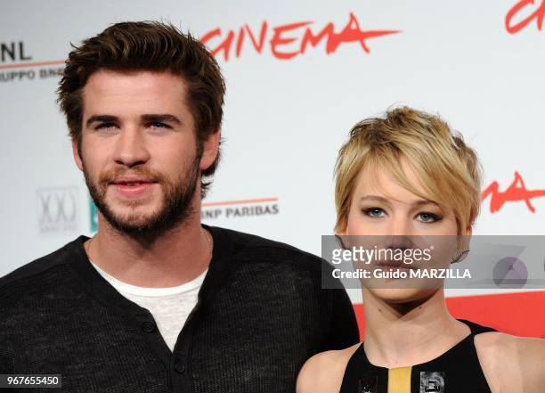 Liam Hemsworth, Jennifer Lawrence attend the 'The Hunger Games: Catching Fire' Photocall during the 8th Rome Film Festival on November 14, 2013 in...