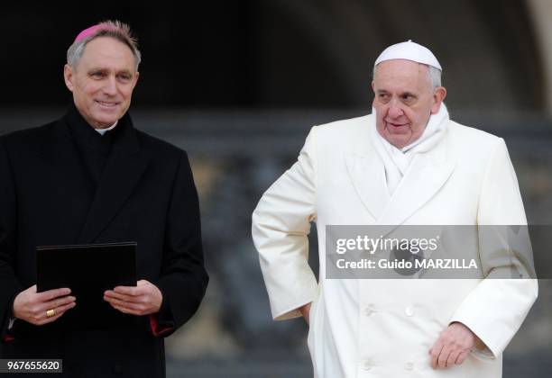 Pope Francis leads the weekly general audience on November 27, 2013 on Saint Peter's square at the Vatican. On the left Georg Ganswein.