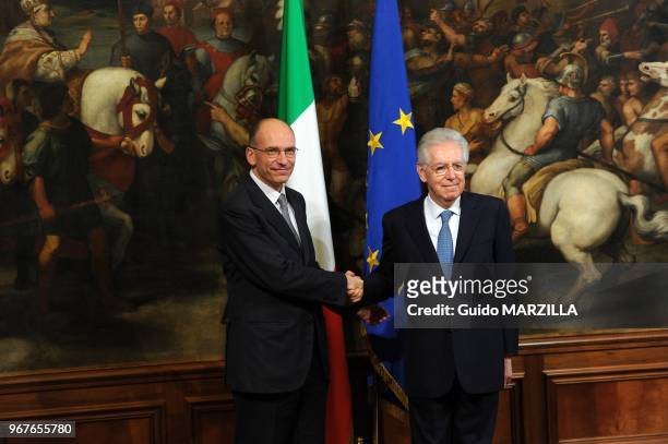 Italy's new Prime Minister Enrico Letta meets outgoing Prime Minister Mario Monti at Palazzo Chigi on April 28, 2013 in Rome, Italy. He received a...