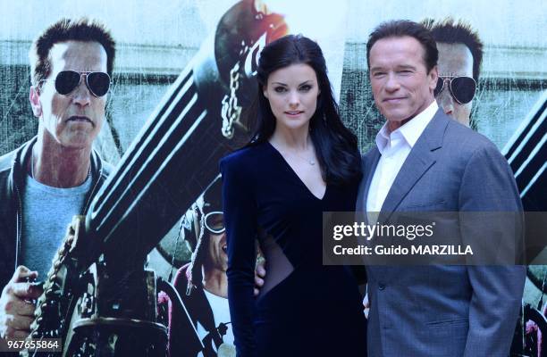 Actors Jamie Alexander and Arnold Schwarzenegger pose during the 'The Last Stand' photocall on January 25, 2013 in Rome, Italy.