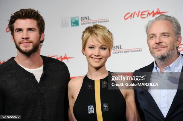 Liam Hemsworth, Jennifer Lawrence, director Francis Lawrence attend the 'The Hunger Games: Catching Fire' Photocall during the 8th Rome Film Festival...