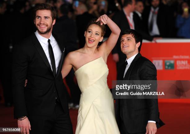 Liam Hemsworth, Jennifer Lawrence and Josh Hutcherson arrive at the 'The Hunger Games: Catching Fire' Premiere during the 8th Rome Film Festival on...