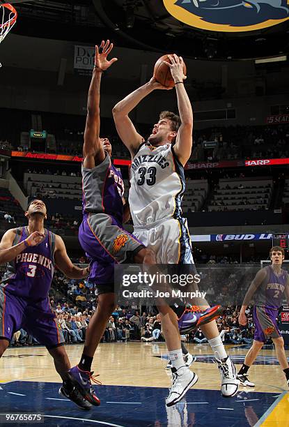 Marc Gasol of the Memphis Grizzlies shoots over Channing Frye of the Phoenix Suns on February 16, 2010 at FedExForum in Memphis, Tennessee. NOTE TO...