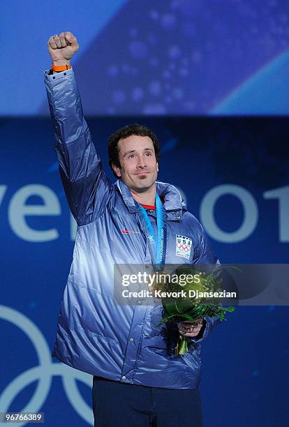 Seth Wescott of the United States celebrates winning the gold medal during the medal ceremony the Men's Snowboard Cross on day 5 of the Vancouver...