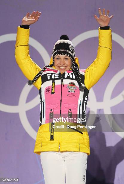 Magdalena Neuner of Germany celebrates winning the gold medal during the medal cermony for the Women's Biathlon 10km Pursuit on day 5 of the...