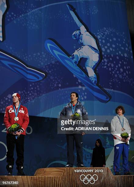 Silver medalist Mike Robertson of Canada, gold medalist Seth Wescott of the US and bronze medalist Tony Ramoin of France pose during the medal...