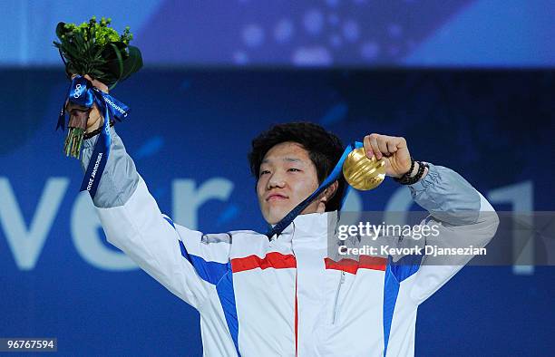 Mo Tae-Bum of South Korea celebrates winning the gold medal during the medal ceremony for the Men's 500m Speed Skating on day 5 of the Vancouver 2010...