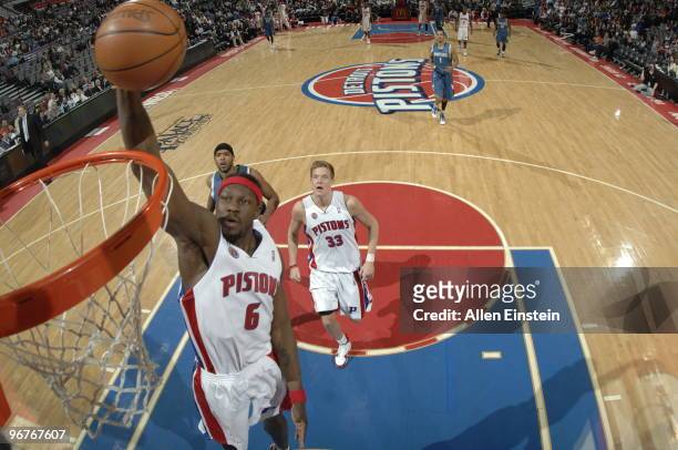 Ben Wallace of the Detroit Pistons goes up for a break away dunk past Ryan Gomes of the Minnesota Timberwolves in a game at the Palace of Auburn...