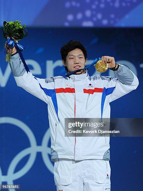 Mo Tae-Bum of South Korea celebrates winning the gold medal during the medal ceremony for the Men's 500m Speed Skating on day 5 of the Vancouver 2010...