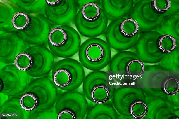 green bottles washed for glass recycling - glass bottle stock pictures, royalty-free photos & images