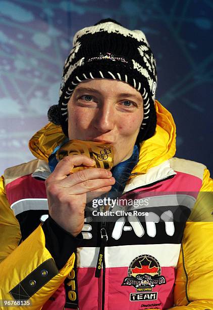 Tatjana Huefner of Germany celebrates winning the gold medal during the medal ceremony for the Women's Luge Singles on day 5 of the Vancouver 2010...