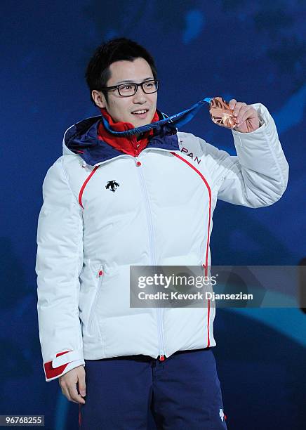 Joji Kato of Japan celebrates winning the bronze medal during the medal cermony for the Men's 500m Speed Skating on day 5 of the Vancouver 2010...