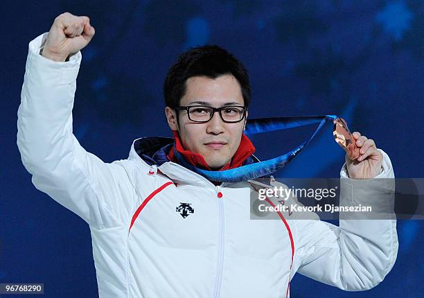 Joji Kato of Japan celebrates winning the bronze medal during the medal cermony for the Men's 500m Speed Skating on day 5 of the Vancouver 2010...