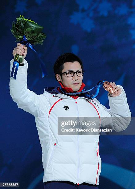 Joji Kato of Japan celebrates winning the bronze medal during the medal cermony for the Men's 500m Speed Skating on day 5 of the Vancouver 2010...