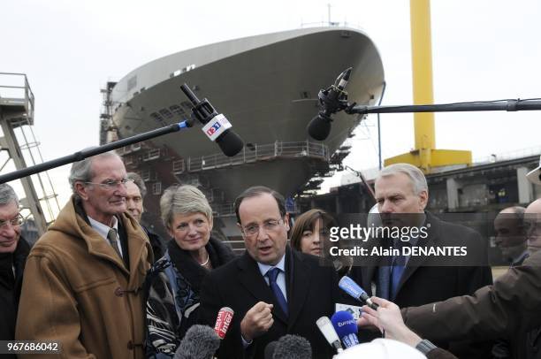 French Socialist Party candidate for the 2012 presidential election Francois Hollande visits the STX shipyard, as part of the campaign, in...