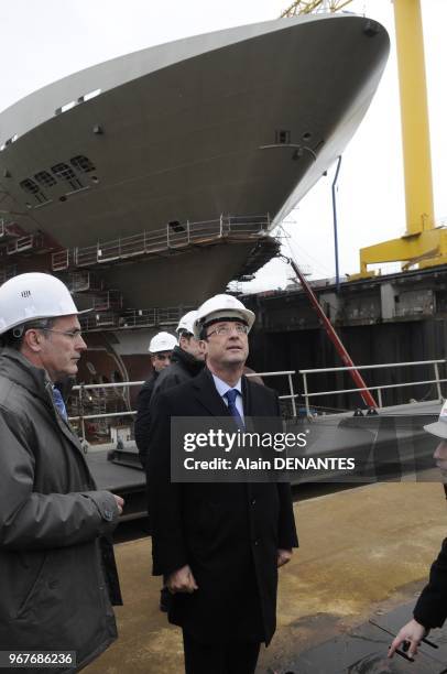 French Socialist Party candidate for the 2012 presidential election Francois Hollande visits the STX shipyard, as part of the campaign, in...