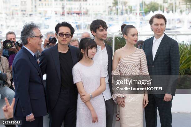 Actors Byung Heebong, Steven Yeun, Ahn Seo-Hyun, Devon Bostick, Lily Collins and Paul Dano attend the 'Okja' photocall during the 70th annual Cannes...