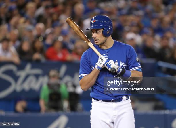 Luke Maile of the Toronto Blue Jays questions a strike call in the second inning during MLB game action against the Oakland Athletics at Rogers...