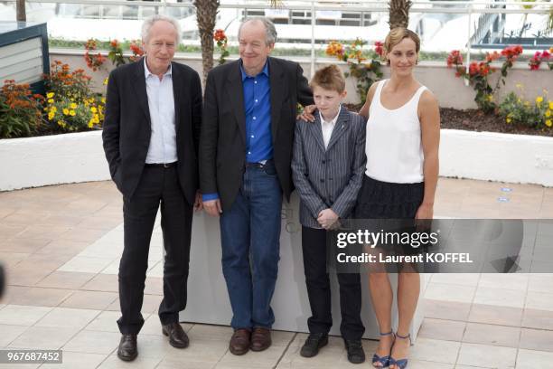 Jean Pierre, Thomas Doret, Cecile de France and Luc Dardenne pose at the "Le Gamin Au Velo" Portrait Session during the 64th Annual Cannes Film...