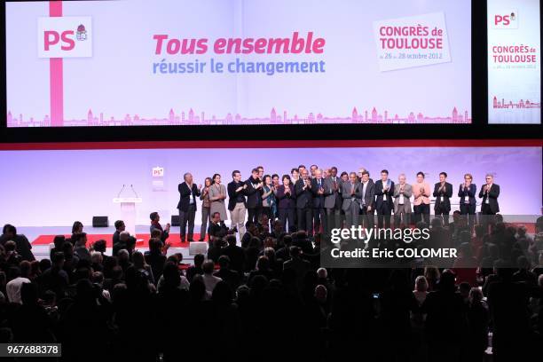 French Socialist Party's former leader and Lille's mayor, Martine Aubry , her successor Harlem Desir and Prime Minister, Jean-Marc Ayrault applaud on...