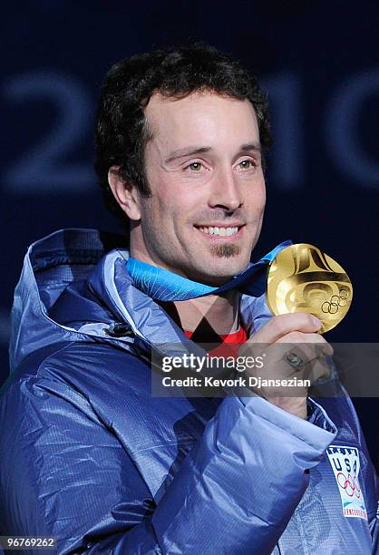 Seth Wescott of the United States celebrates winning the gold medal during the medal ceremony the Men's Snowboard Cross on day 5 of the Vancouver...