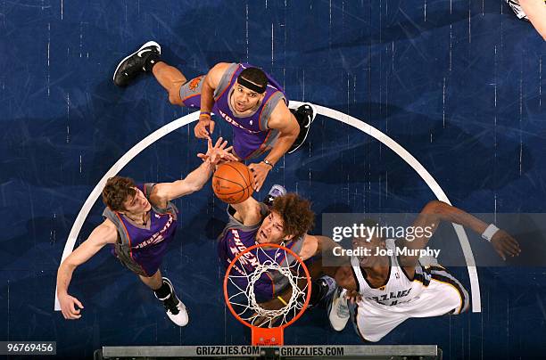 Robin Lopez, Goran Dragic and Jared Dudley of the Phoenix Suns battle for a rebound against Hasheem Thabeet of the Memphis Grizzlies on February 16,...