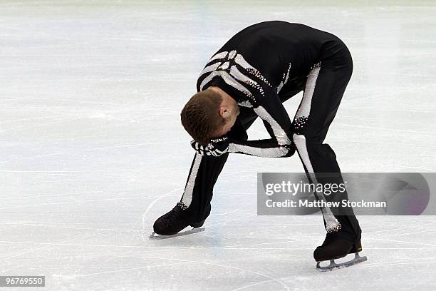 Kevin van der Perren of Belgium reacts in the men's figure skating short program on day 5 of the Vancouver 2010 Winter Olympics at the Pacific...