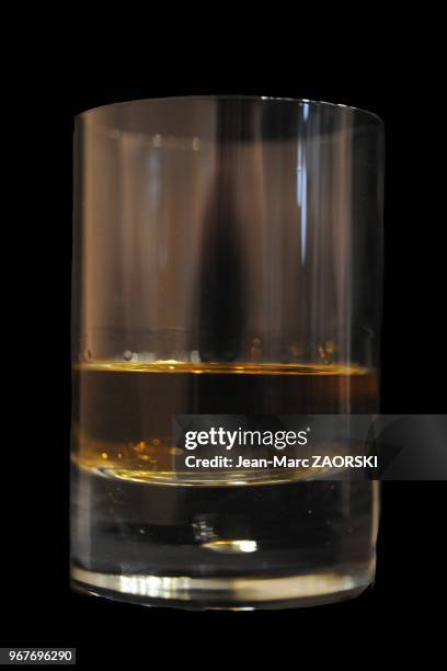 Whisky in a glass with black background in Bouc Bel Air in France on April 23, 2012.